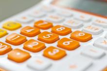 close up of orange keypad on calculator